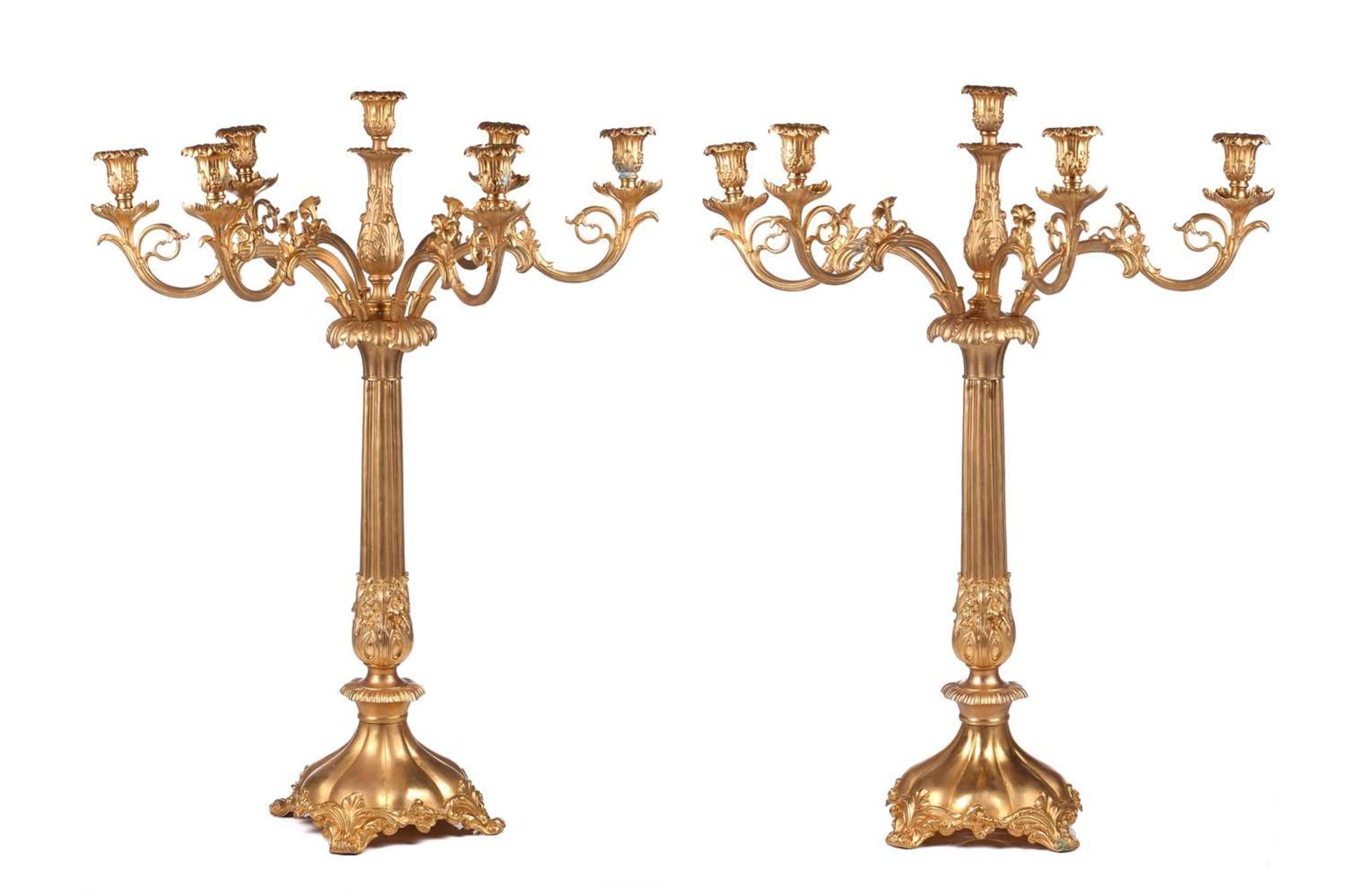 A pair of large, impressive gilt metal table candelabrum with seven removable convolvulus vine