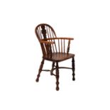 A 19th century Nottinghamshire yew wood and ash Windsor chair with shaped and pierced back splat,