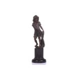 A bronze figure of a young boy with a fishing net, 19th century, French, on a black marble pedestal,