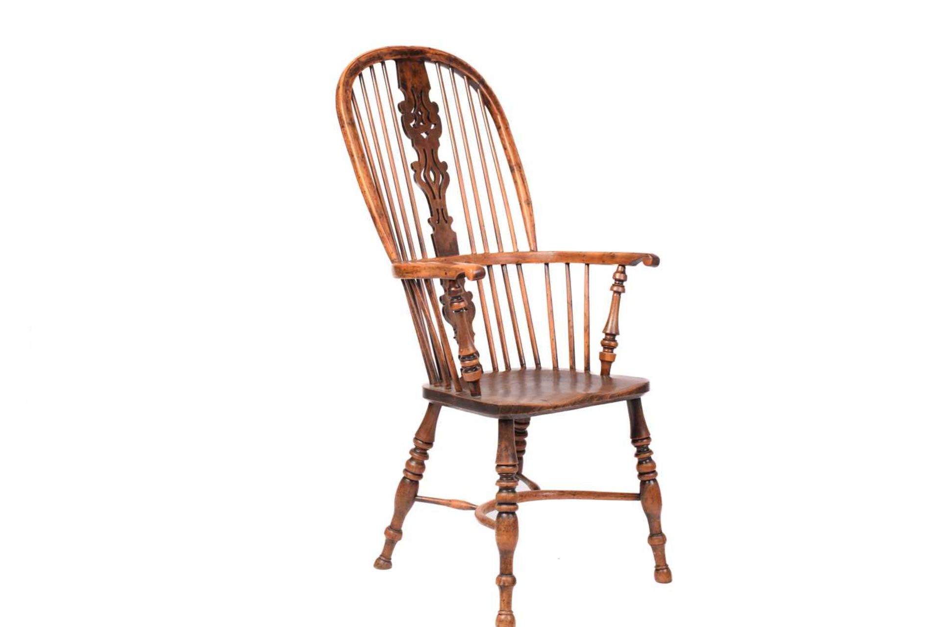 A 19th century Nottinghamshire yew wood and ash high back Windsor chair, with shaped and pierced