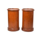 A pair of Victorian style mahogany cylinder pot cupboards, 20th century, with part blind gallery