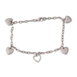 Tiffany & Co. - a diamond-set heart charm bracelet in platinum, comprising a cable link chain,