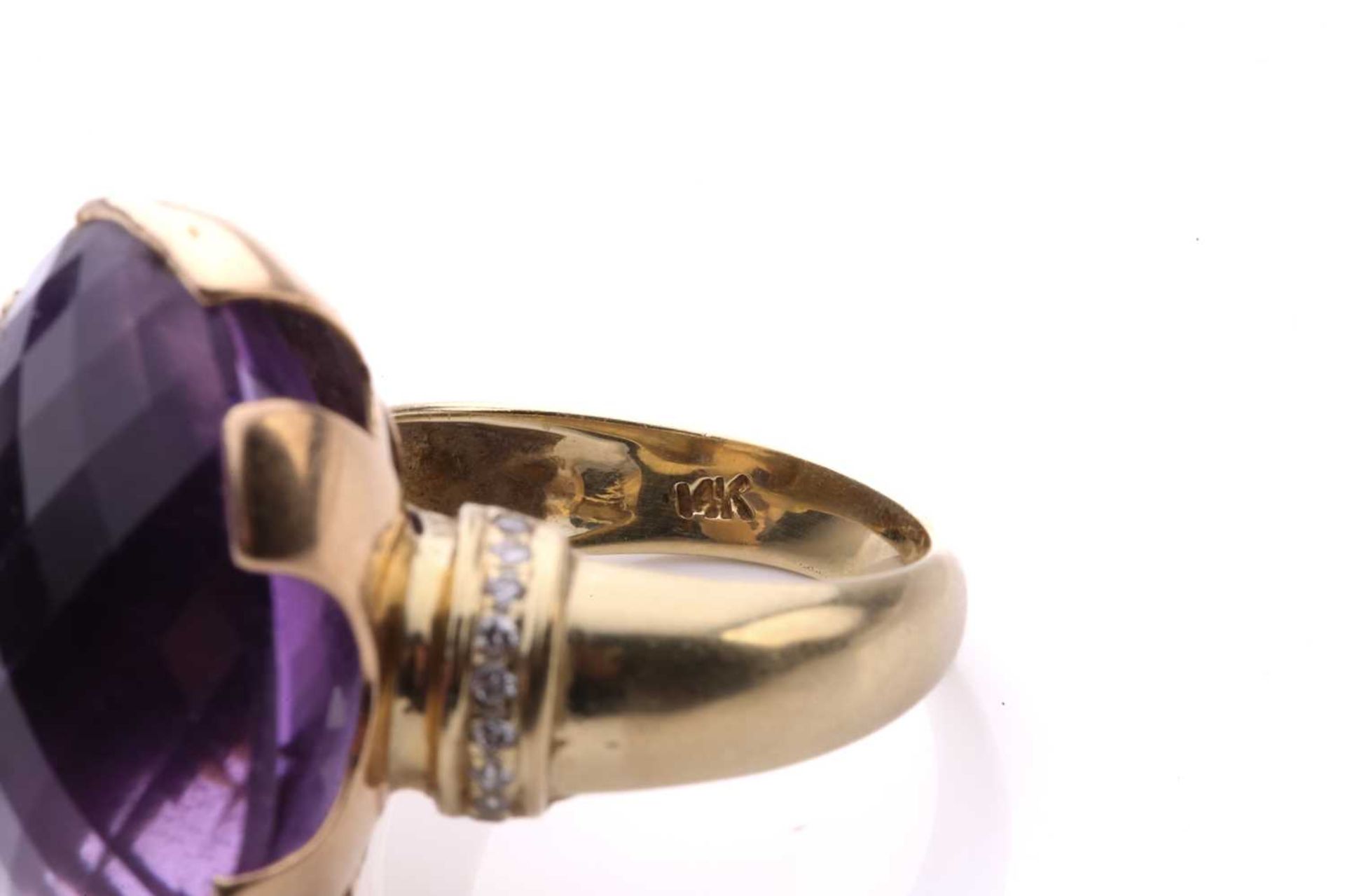 A large amethyst cocktail ring, set with an oval fancy cut amethyst of 25mm x 18mm x 14mm, each - Image 7 of 8