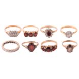 A collection of gem-set rings, including a diamond eternity ring with hallmarks for 18ct gold,