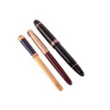 Three fountain pens; a Montblanc Meisterstück No. 149 fountain pen with yellow-tone hardware, and