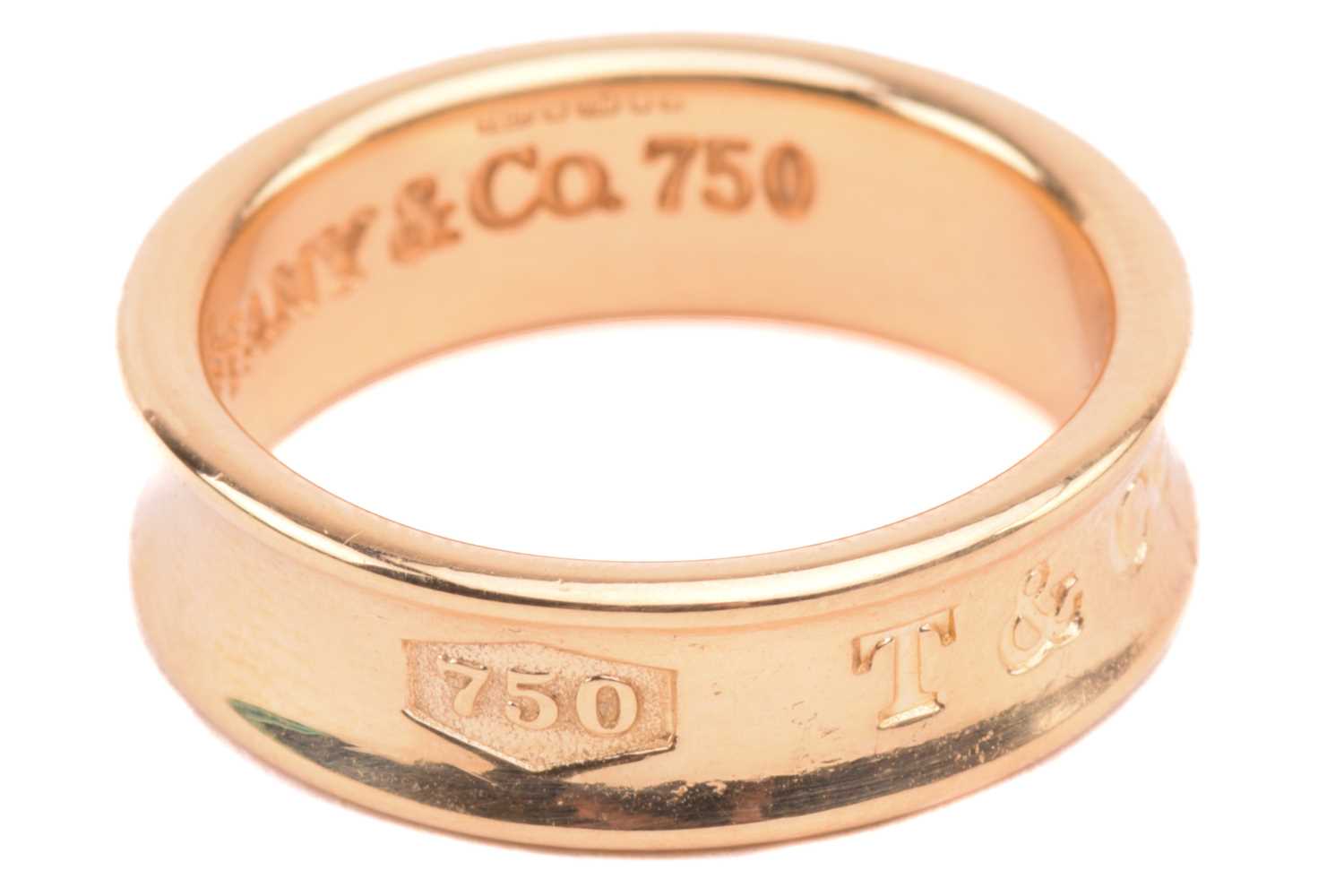 Tiffany & Co. - an 18ct yellow gold ring from the '1837' collection, the 6.1 mm wide concave band - Image 3 of 5