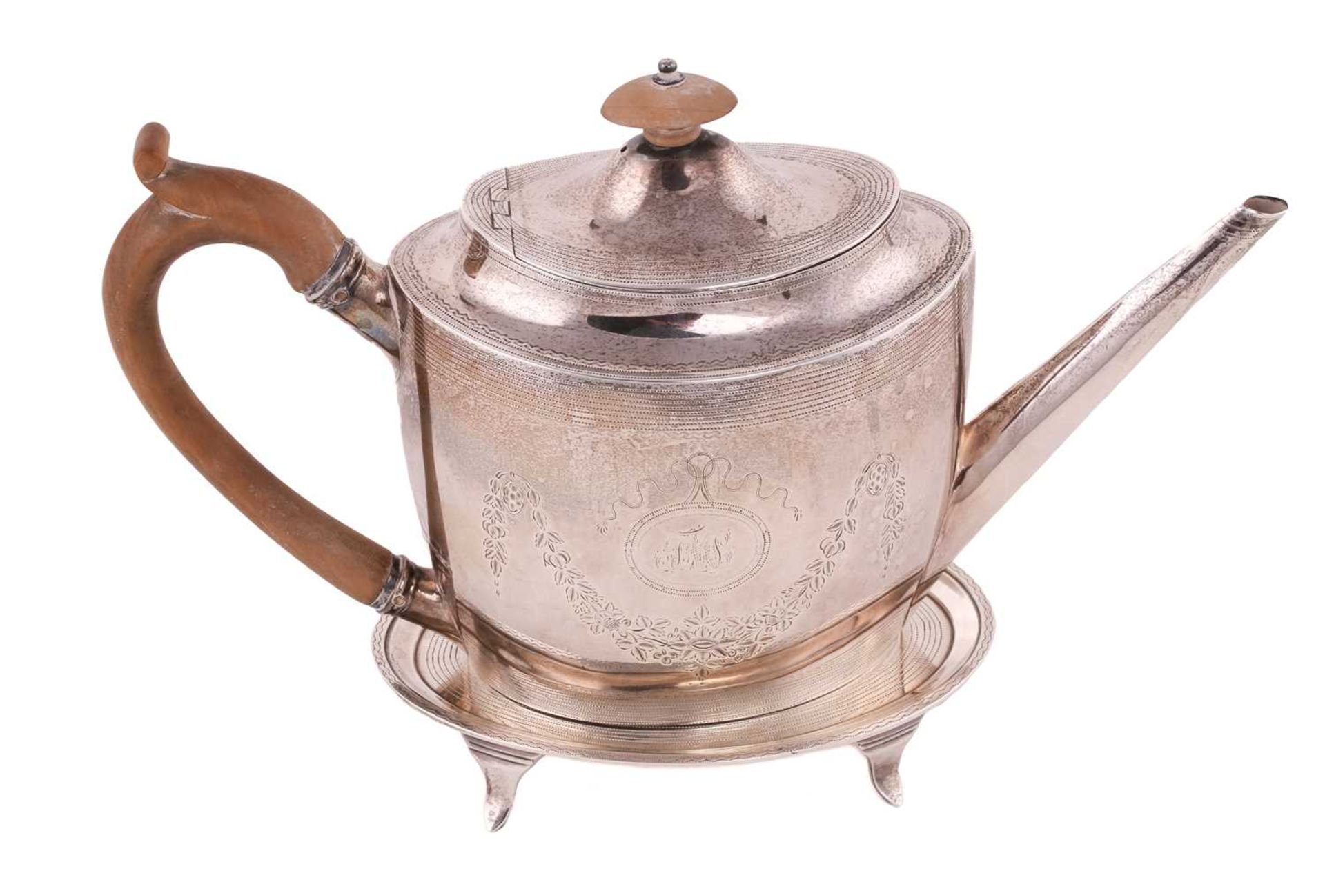 A George III silver teapot and stand, by George Smith II & Thomas Hayter, London 1796, of oval form,