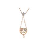 An Edwardian enamel and pearl floral pendant necklace designed as a heart with a spray of flowers in