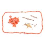 A small collection of coral jewellery items and others; including an aquamarine and seed pearl bar