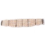 A five-row graduated pearl bracelet with diamond-set spacers, comprising one hundred and ten