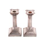 A pair of Corinthian column candlesticks, Sheffield 1891, by James Kebberling Bembridge of