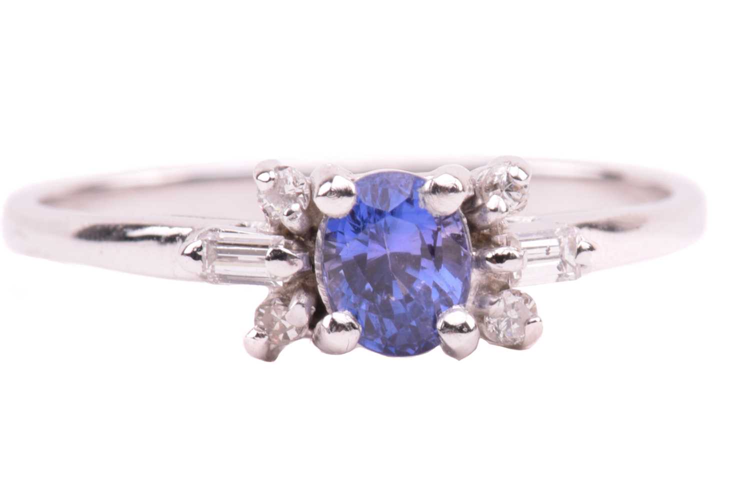 A sapphire and diamond dress ring, centred with an oval-cut sapphire of purplish-blue, with - Image 11 of 20