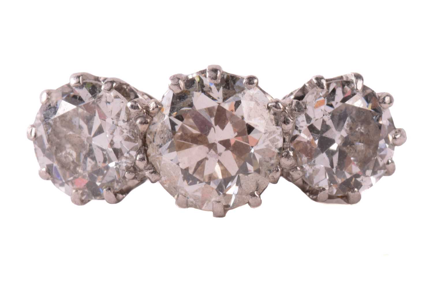 A three-stone diamond half-hoop ring, coronet-set with three graduated old-cut diamonds with an