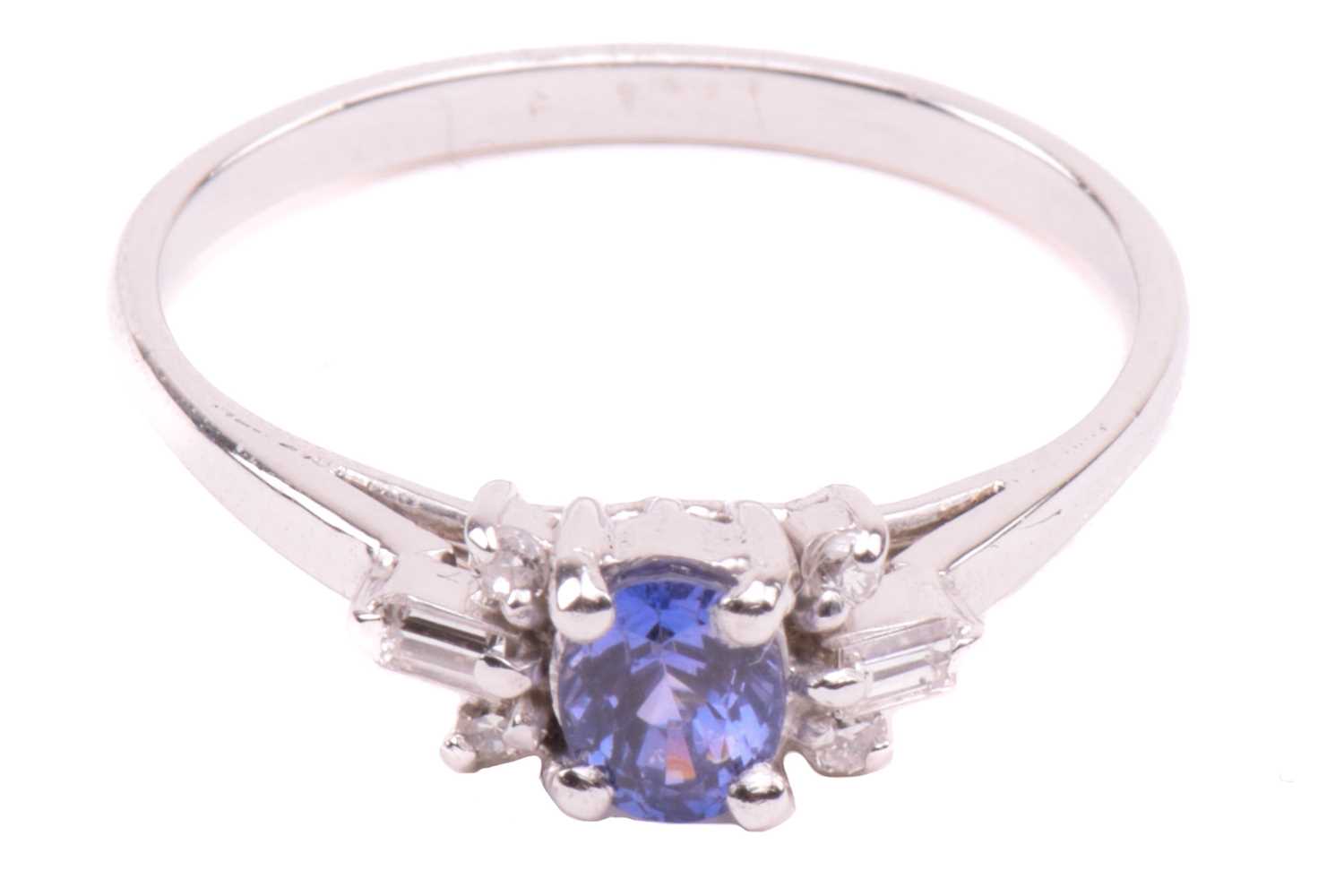 A sapphire and diamond dress ring, centred with an oval-cut sapphire of purplish-blue, with - Image 2 of 20