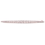 A diamond bar brooch, circa 1930, designed as a graduated row of old cut diamonds with a total