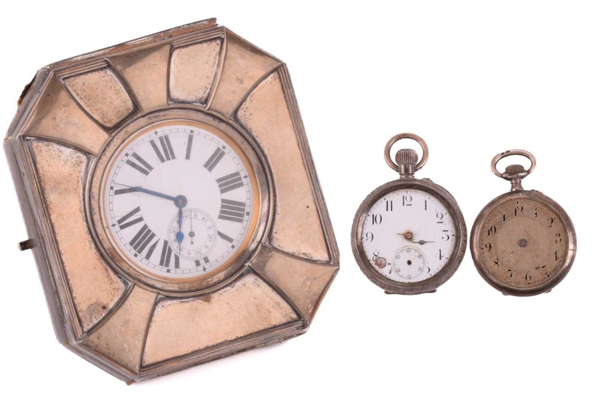 A Goliath pocket watch in a silver case and two further silver pocket watches. The Goliath pocket