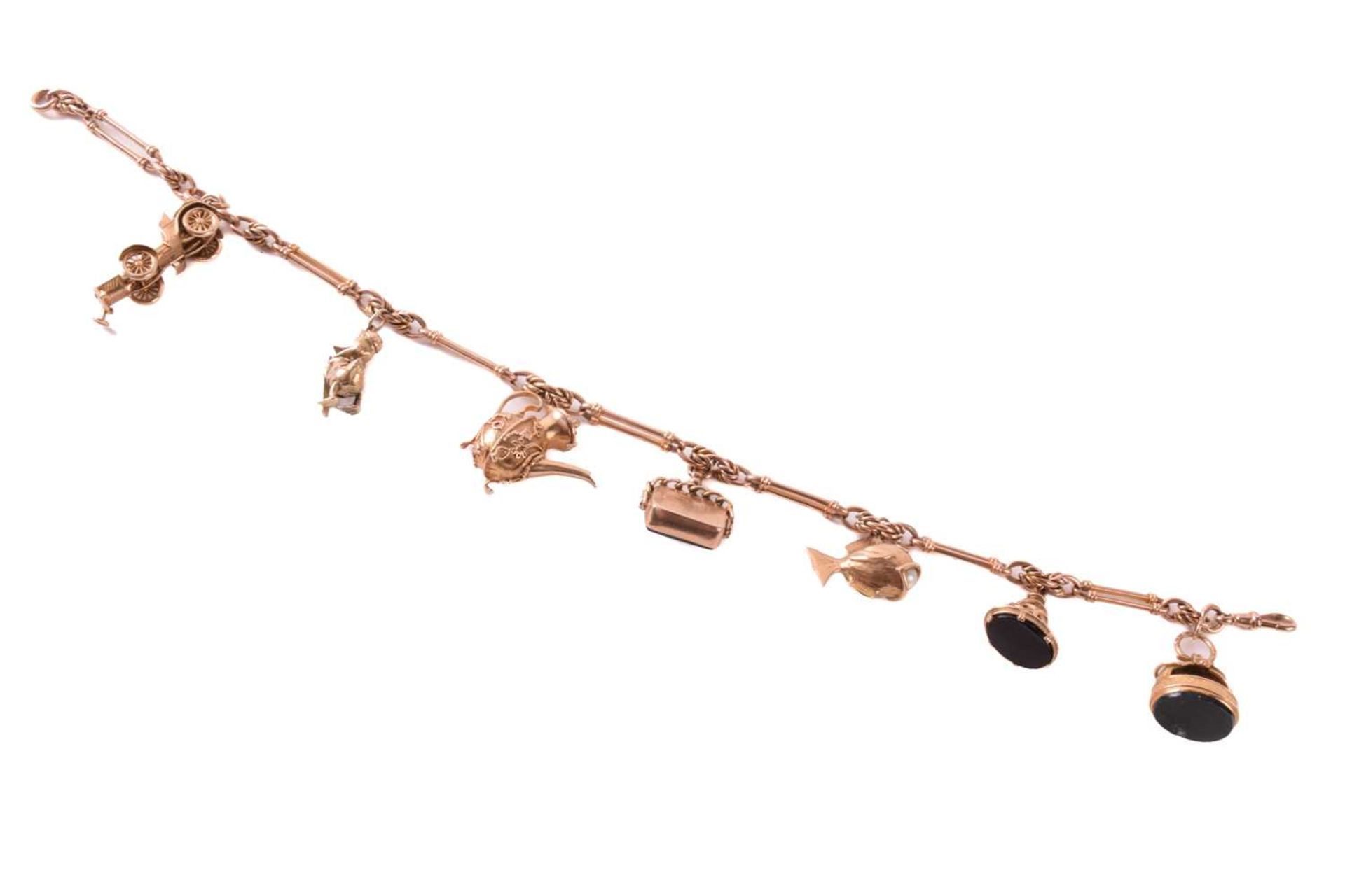 A 9ct rose gold watch chain with charms, comprising a trombone link chain terminated with a swivel - Image 2 of 4