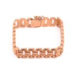 A chevron link bracelet, hinged links of rhombic motifs fastened with a concealed tongue clasp,