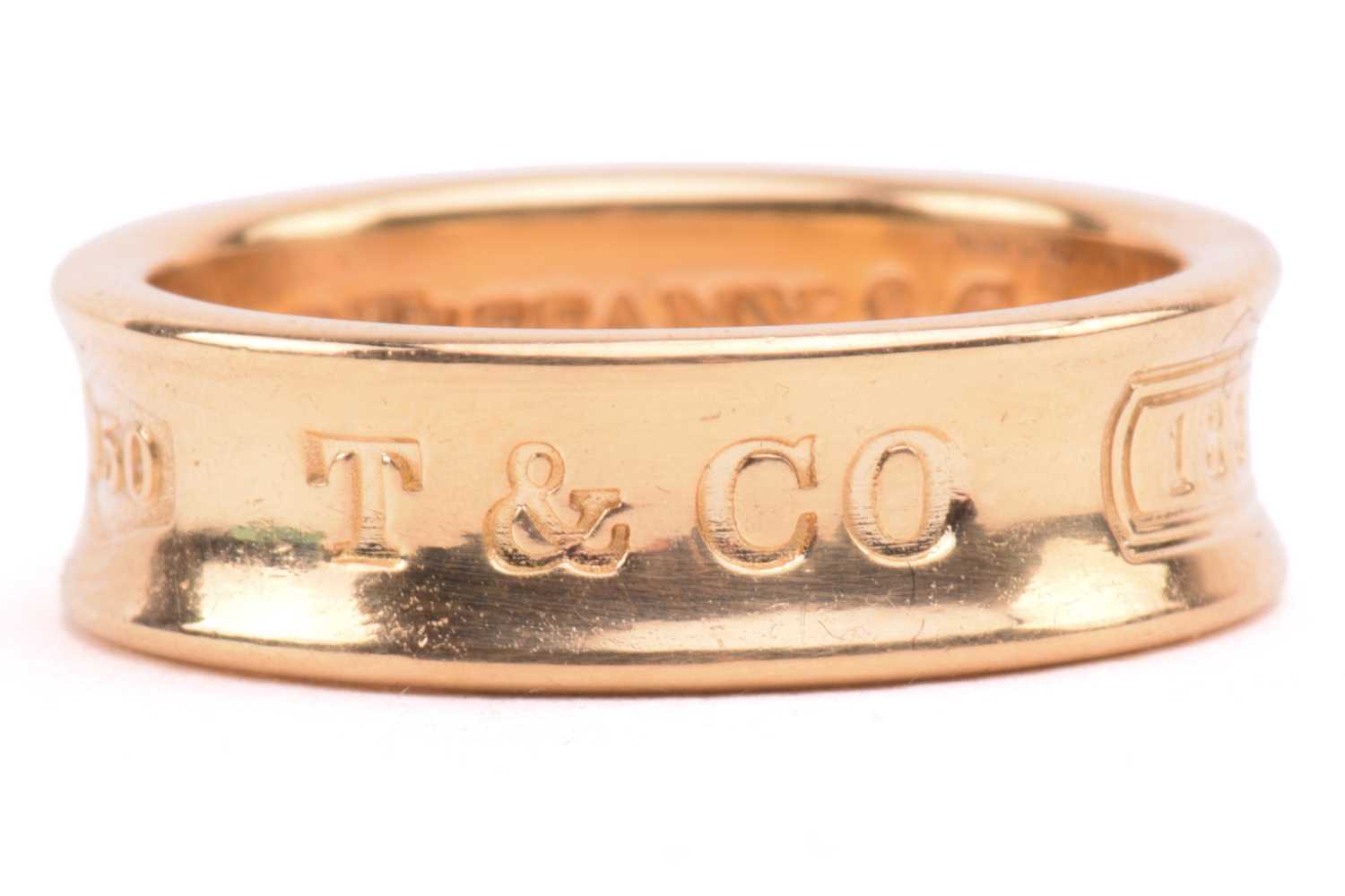 Tiffany & Co. - an 18ct yellow gold ring from the '1837' collection, the 6.1 mm wide concave band - Image 5 of 5