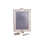 A 20th-century silver easel-back photo frame, London hallmarked with R B B makers mark, with crest