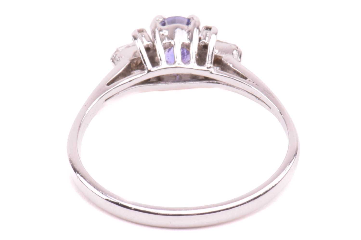 A sapphire and diamond dress ring, centred with an oval-cut sapphire of purplish-blue, with - Image 20 of 20