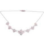 A diamond cluster necklace, set with an estimated total diamond weight of 8.40cts, the central