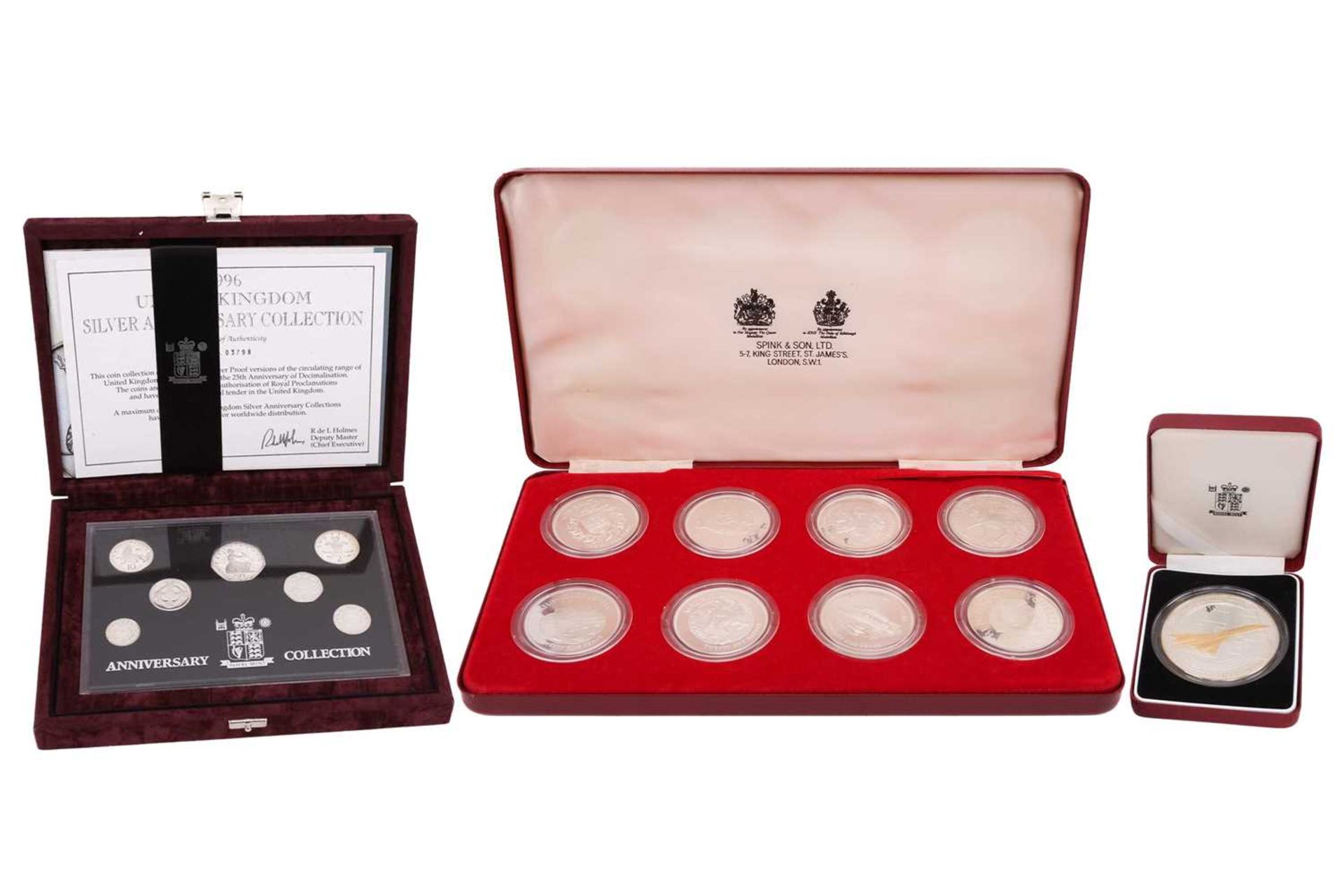 A cased set of eight proof silver encapsulated crown pieces, to commemorate Queen Elizabeth II