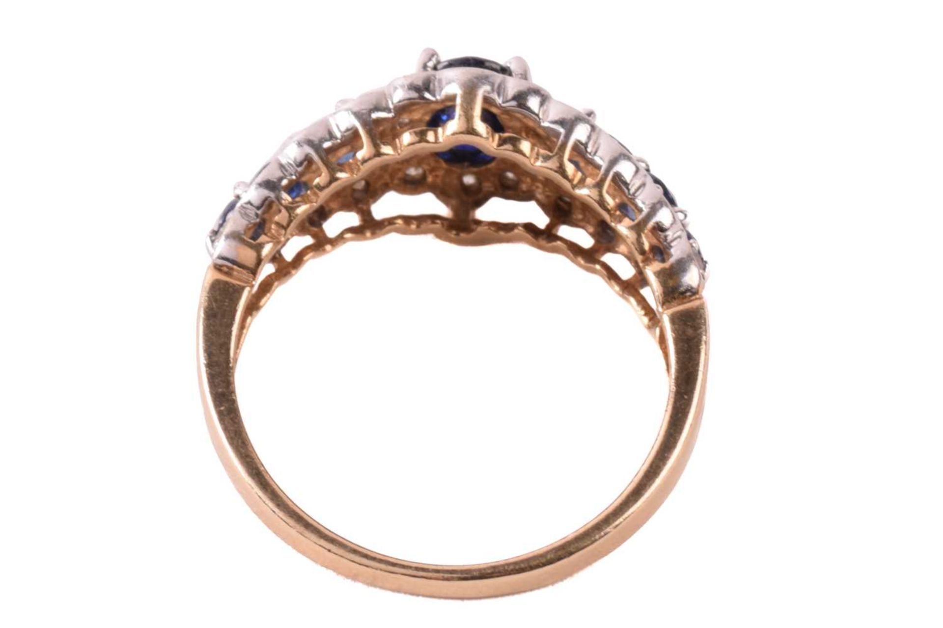 A sapphire and diamond dress ring in 9ct gold, claw-set with an oval-cut sapphire of 6.1 x 4.3 mm - Image 5 of 6