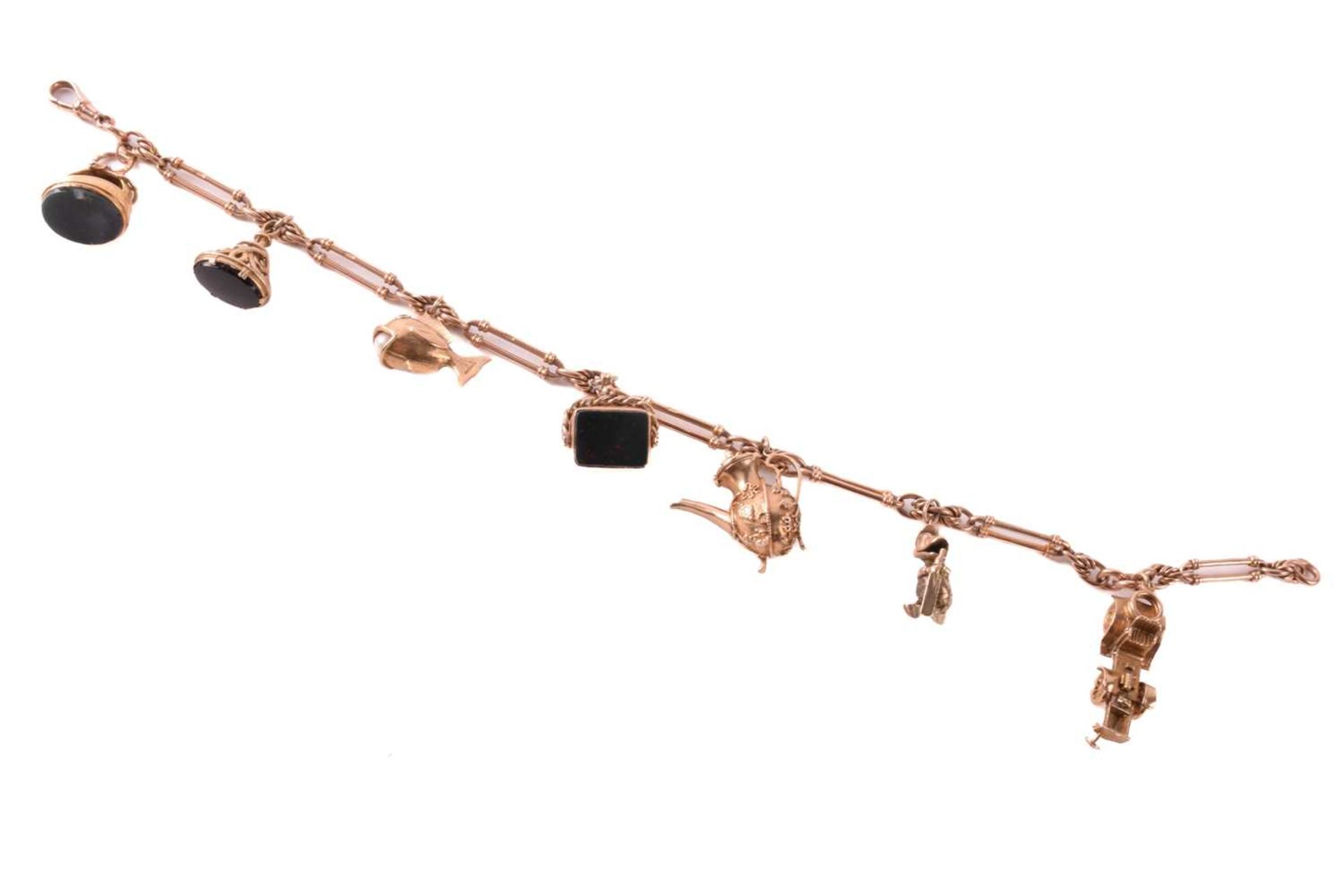 A 9ct rose gold watch chain with charms, comprising a trombone link chain terminated with a swivel - Image 3 of 4