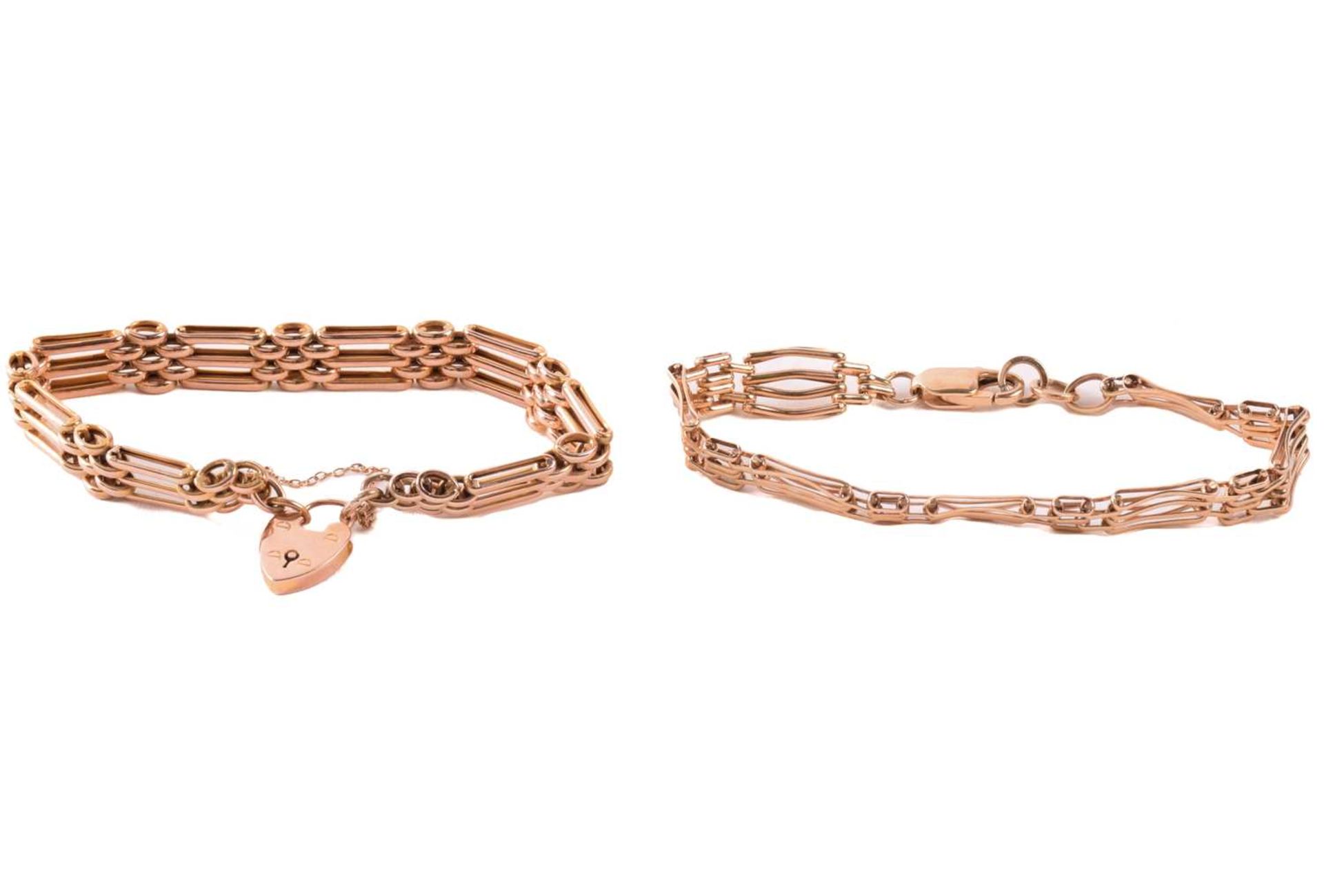 Two 9ct yellow gold gate link bracelets; comprising a bracelet with lobster clasp, Birmingham