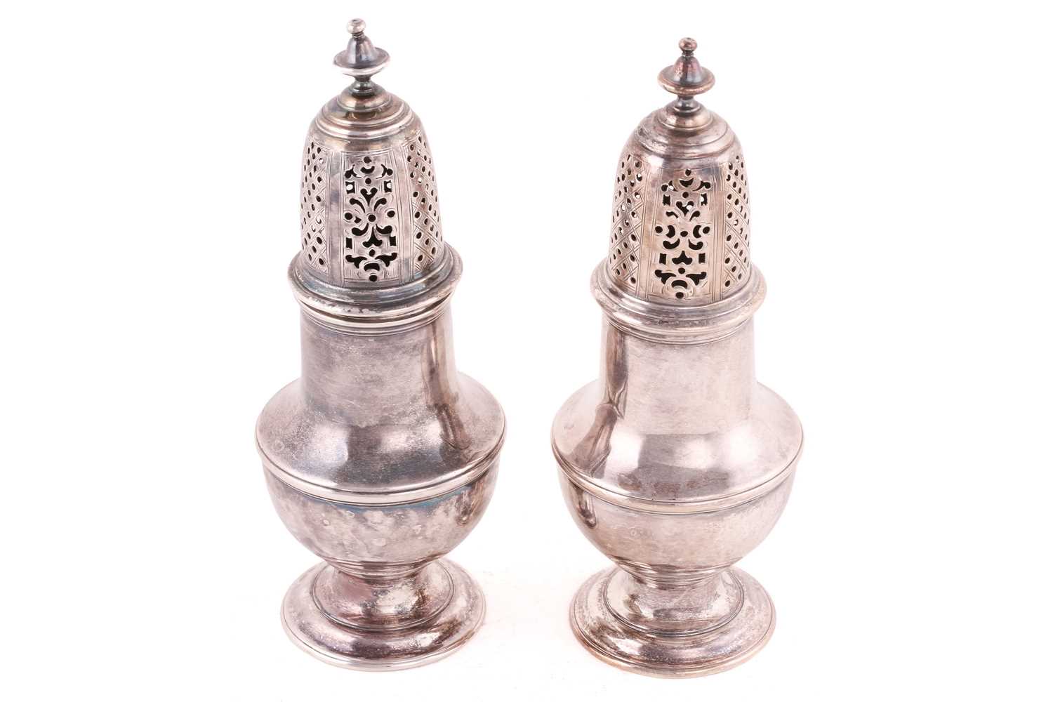 A pair of George III silver sugar casters, London 1779 by Samuel Wood, each of baluster form on - Image 2 of 6