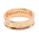 Tiffany & Co. - an 18ct yellow gold ring from the '1837' collection, the 6.1 mm wide concave band