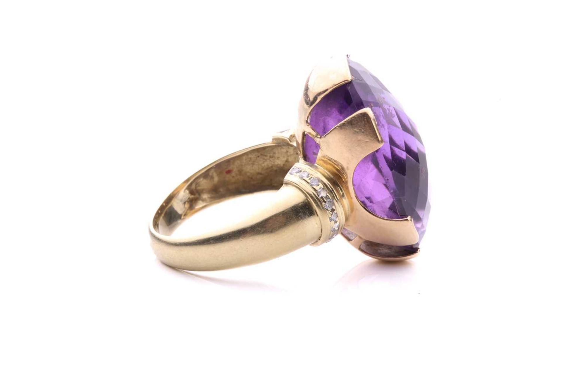 A large amethyst cocktail ring, set with an oval fancy cut amethyst of 25mm x 18mm x 14mm, each - Image 4 of 8