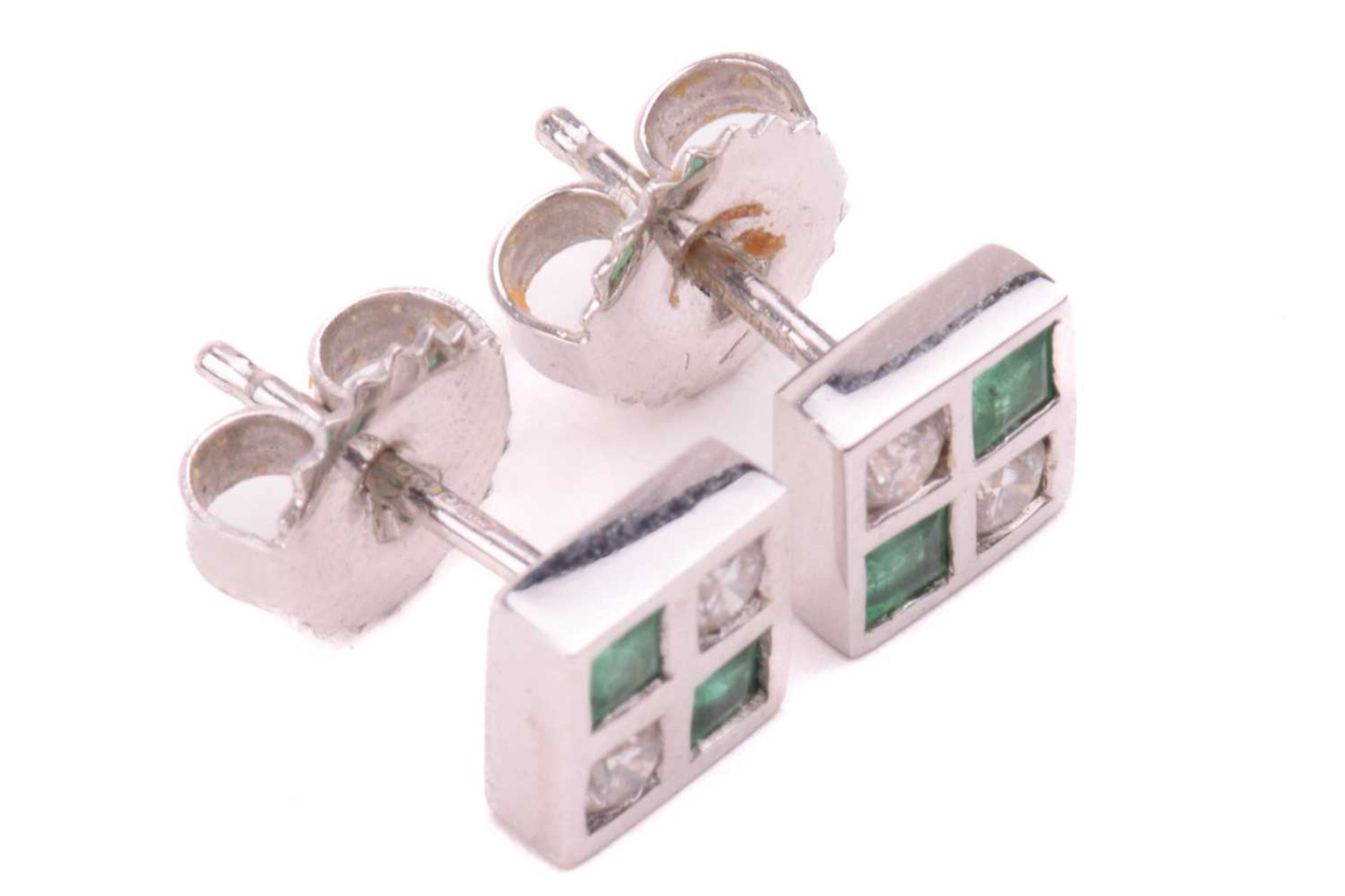 A pair of emerald and diamond stud earrings in 18ct white gold, each comprising two circular-cut - Image 3 of 4
