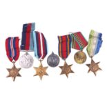 A group of seven medals, comprising: the 1939-45 Star, the Atlantic Star, the Burma Star, a