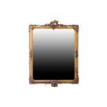 A 19th century gilt framed mirror, with pierced rococo style shell and floral pediment, with