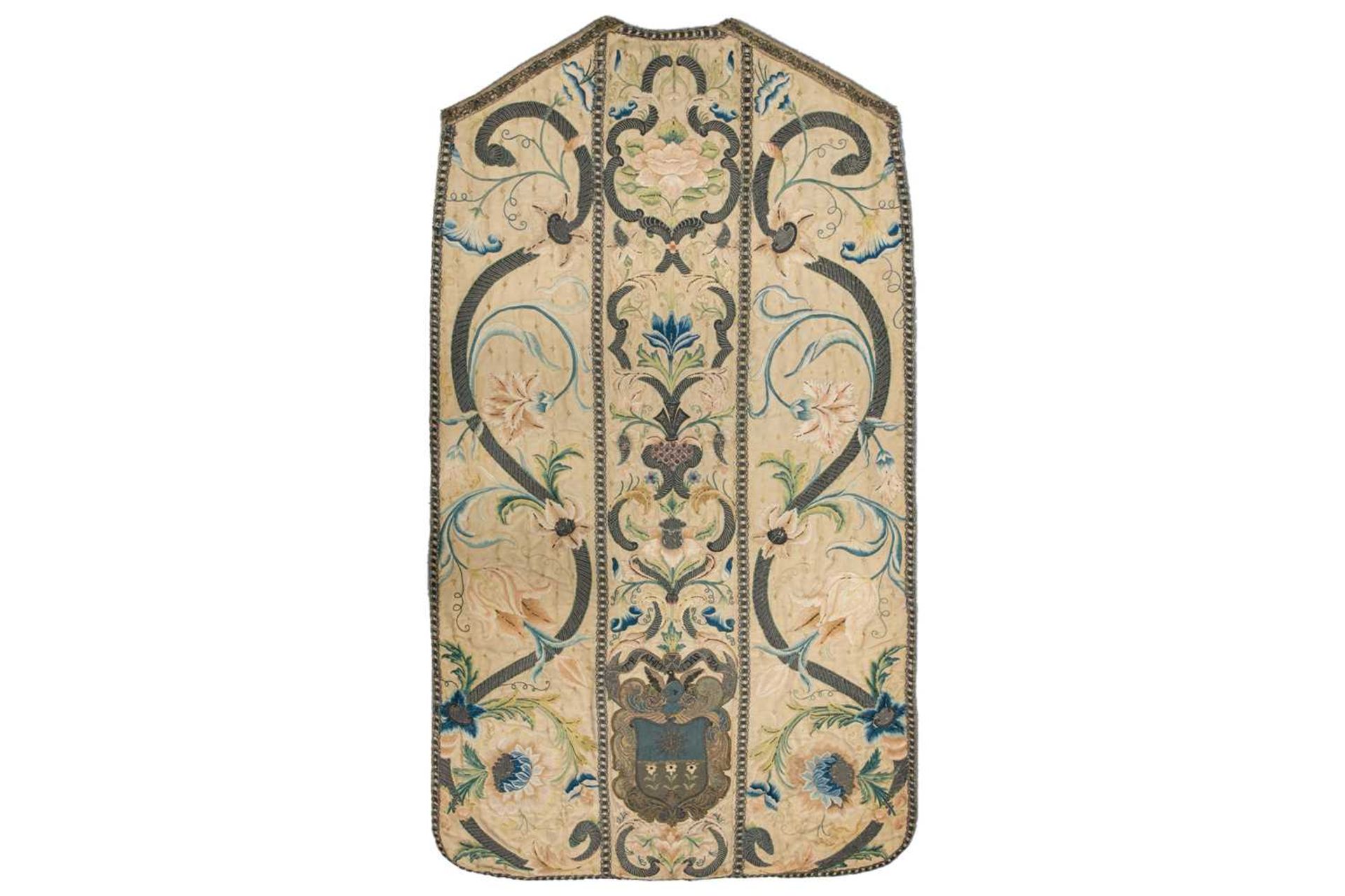 An 18th-century silk and metal thread-worked Chasuble panel, worked with a coat of arms, 119 cm