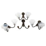 Four sets of late 19th-century French-style brass wall sconces, twin branch with leaf decoration,