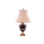 A large French ormolu and cobalt-blue ceramic table lamp, originally converted from an oil lamp,