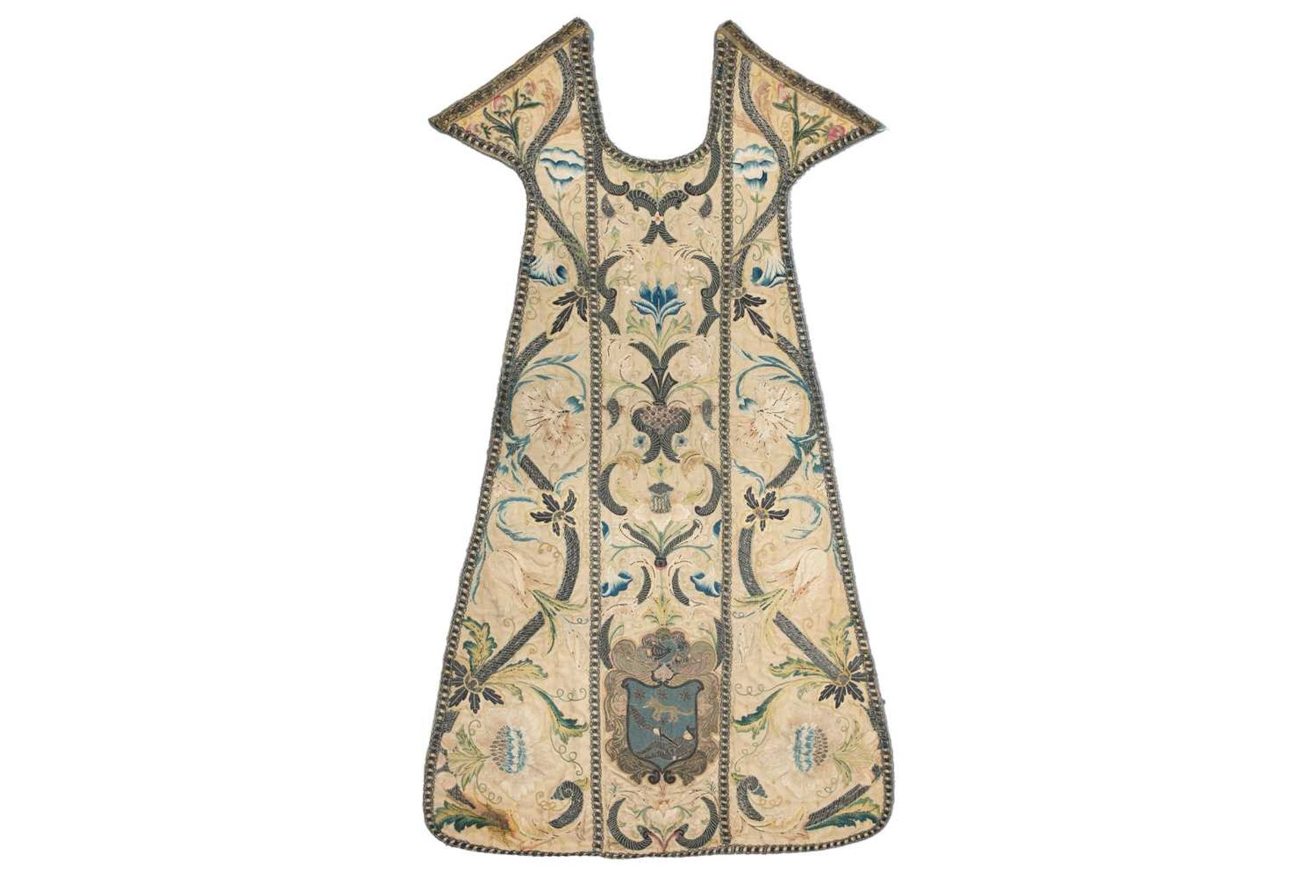 An 18th-century silk and metal thread embroidered Chasuble panel, worked with a coat of arms, 121 cm