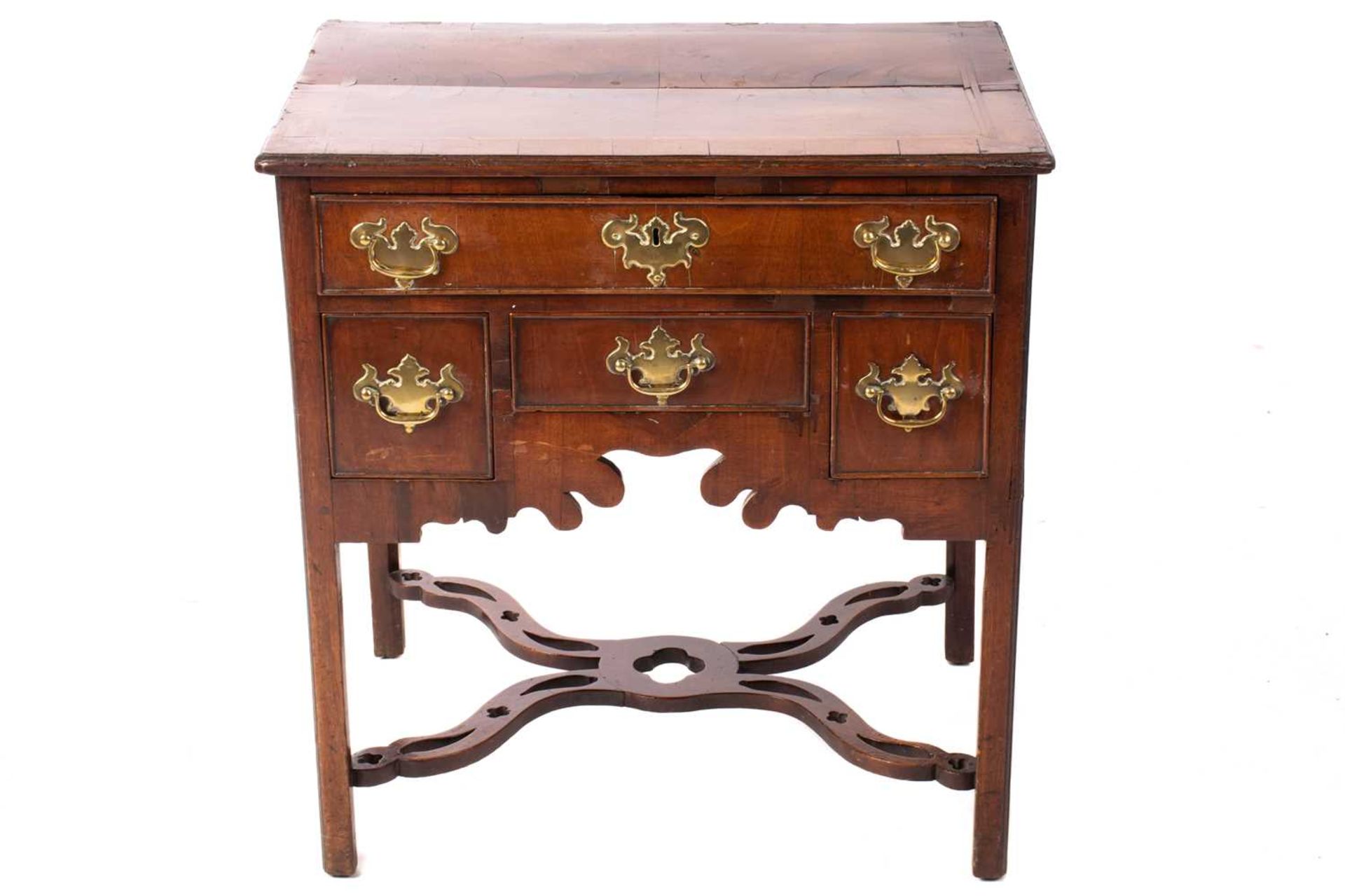 A George III mahogany kneehole lowboy with cross and feather banded top above a single frieze drawer