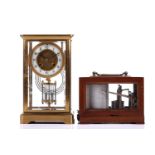 An early 20th-century French "four-glass" mantle clock in a simple gilt brass ogee case, the 8-day