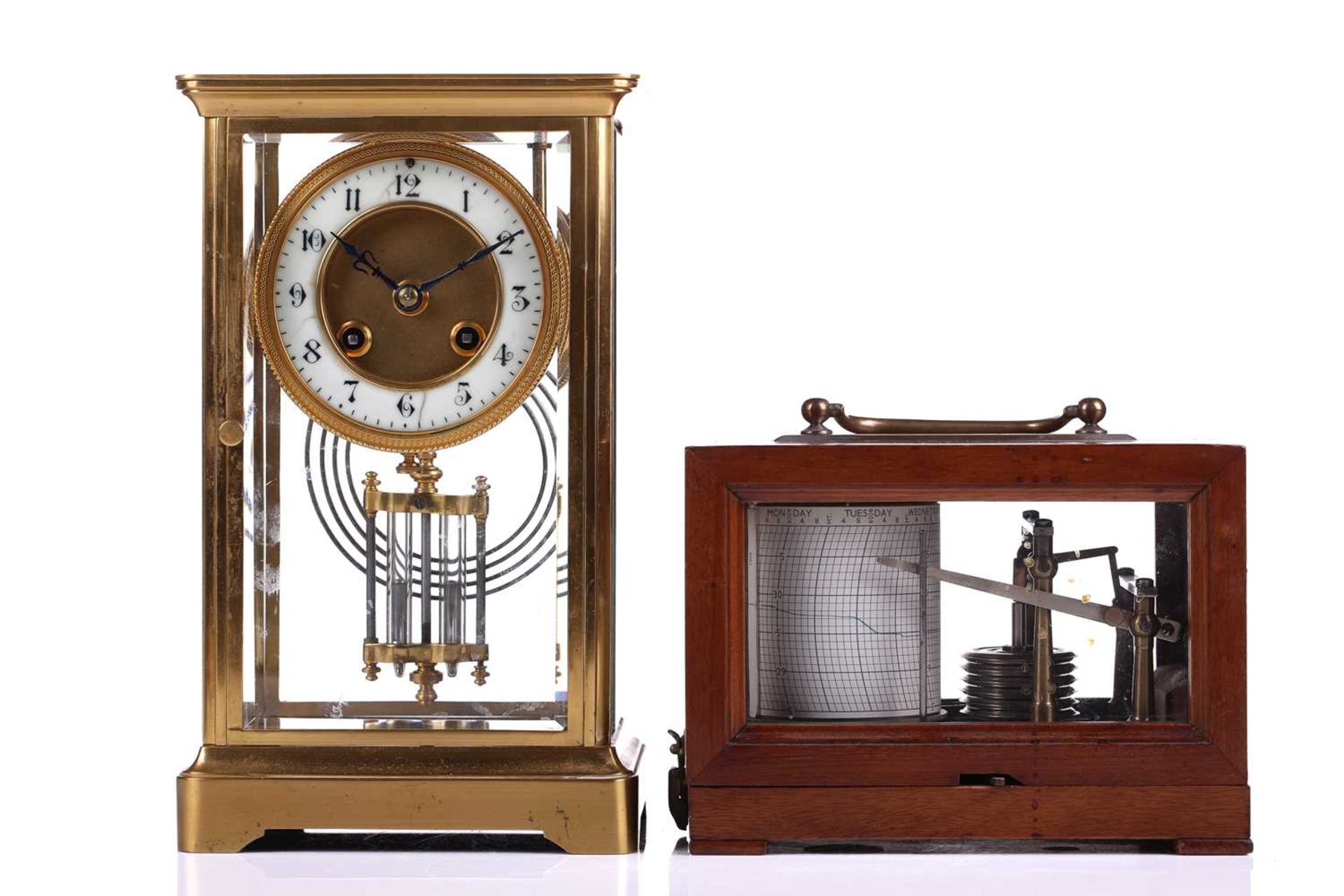 An early 20th-century French "four-glass" mantle clock in a simple gilt brass ogee case, the 8-day