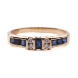 A sapphire and diamond half-hoop ring, segments channel-set with square table-cut sapphires, flanked