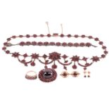 A Victorian Bohemian garnet necklace, set with clusters and swags of garnets, with a length of 47cm,