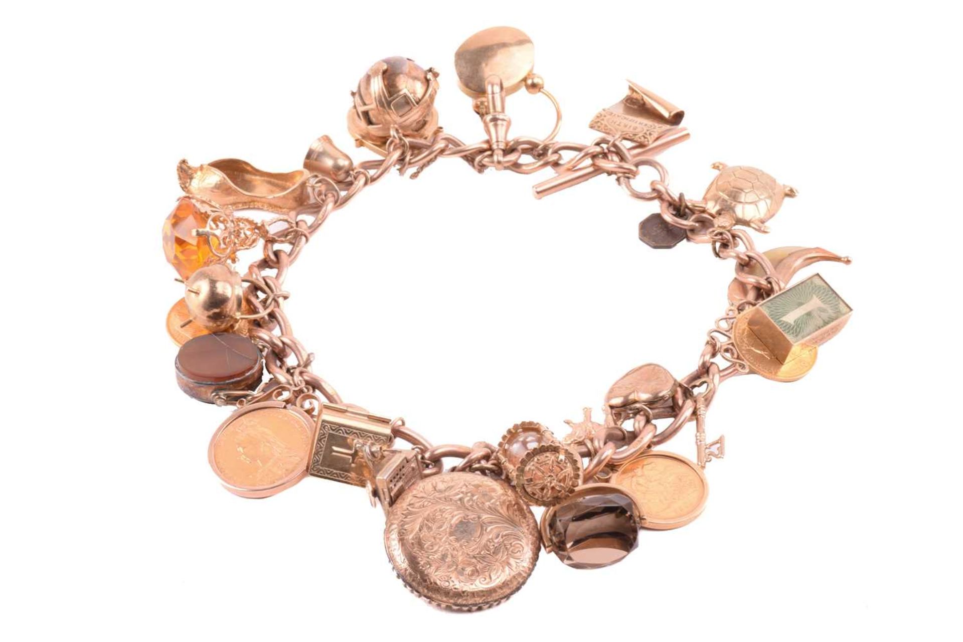 A double Albert chain charm bracelet in 9ct rose gold, constituted of a heavy curb link terminated