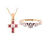 A diamond solitaire ring and a gem-set cross on chain; the ring contains a brilliant-cut diamond