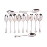 A collection of twelve various silver table spoons, including a George I example by Samuel Hutton,