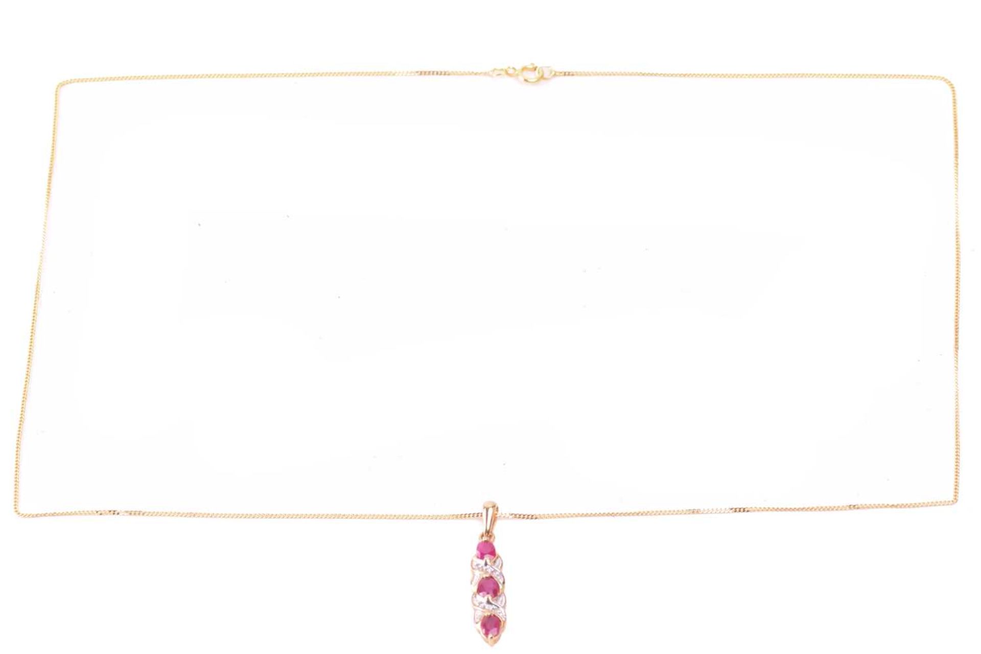 A ruby necklace and earrings ensuite together with a dress ring; the pendant set with three oval-cut - Image 2 of 8