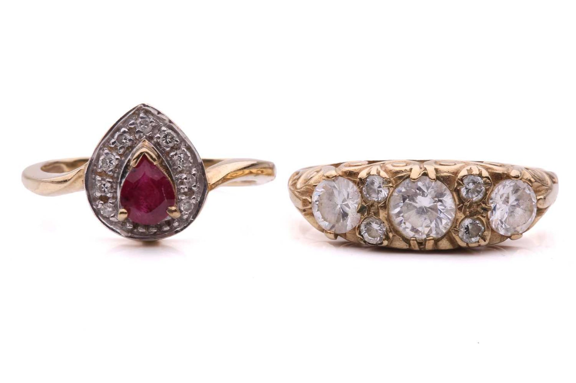 Two gem-set dress rings; the ruby and diamond cluster ring, set with a pear shape ruby surrounded by